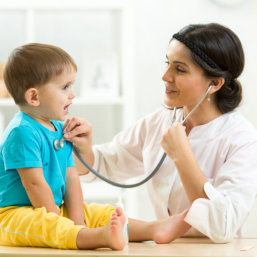 doctor checking boy's health