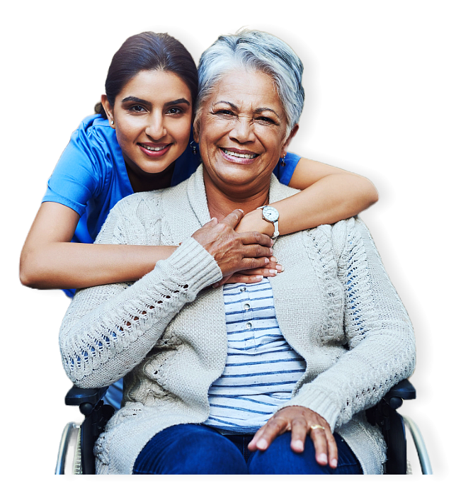 A caregiver hugging senior while smiling