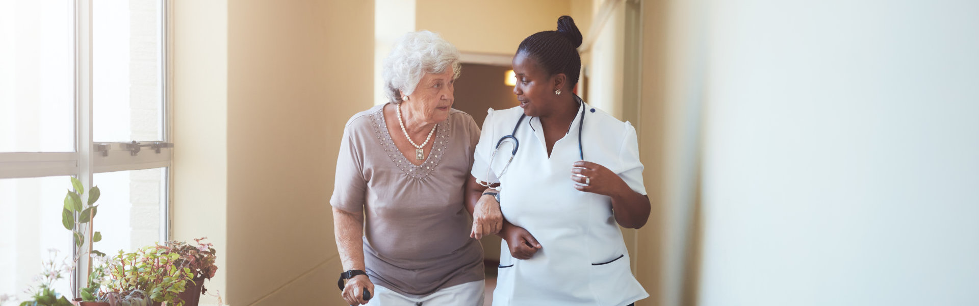 nurse assisting senior