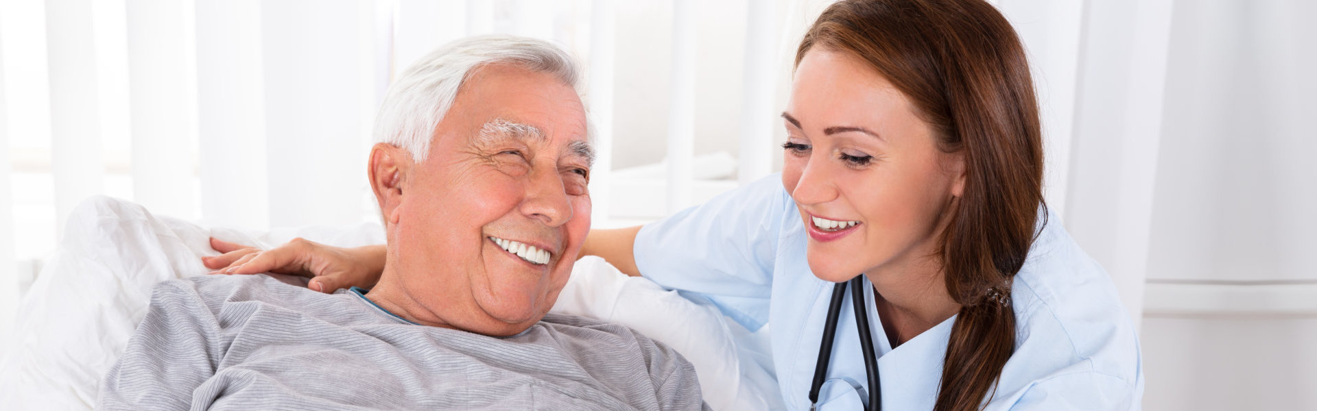 nurse and senior smiling