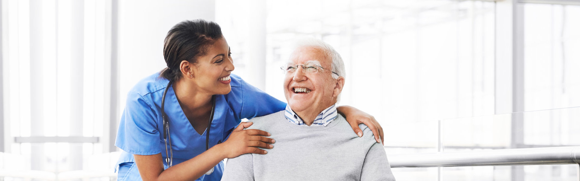 nurse and senior smiling